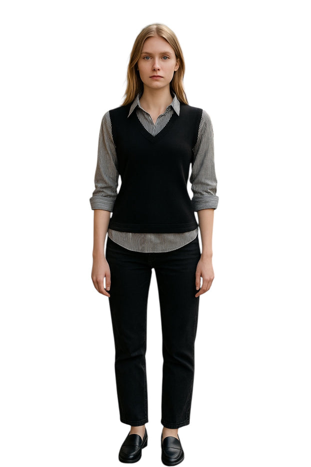 Grey and Black wearing a layered outfit, v-neck sweater vest over a patterned collared shirt.