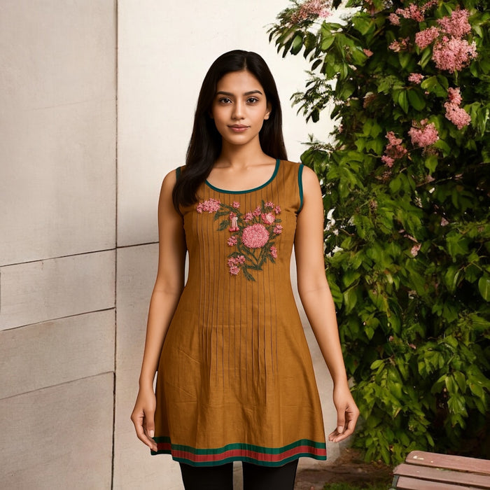 100% Cotton Vertical Stitched Pleats with Floral embroider Multi Color trimmed Round Neck, hem and armholes. Sleeveless Tunic, Kurti.